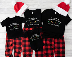 a family of three wearing matching christmas pajamas