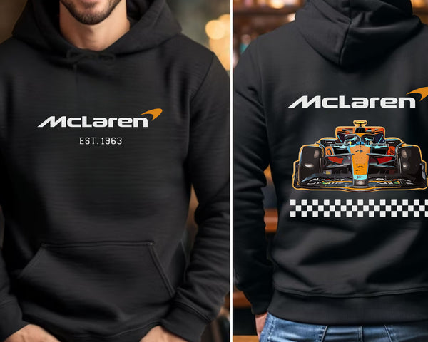 a man wearing a black hoodie with a racing car on it