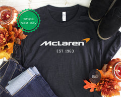 a black t - shirt with the name mcaaren on it